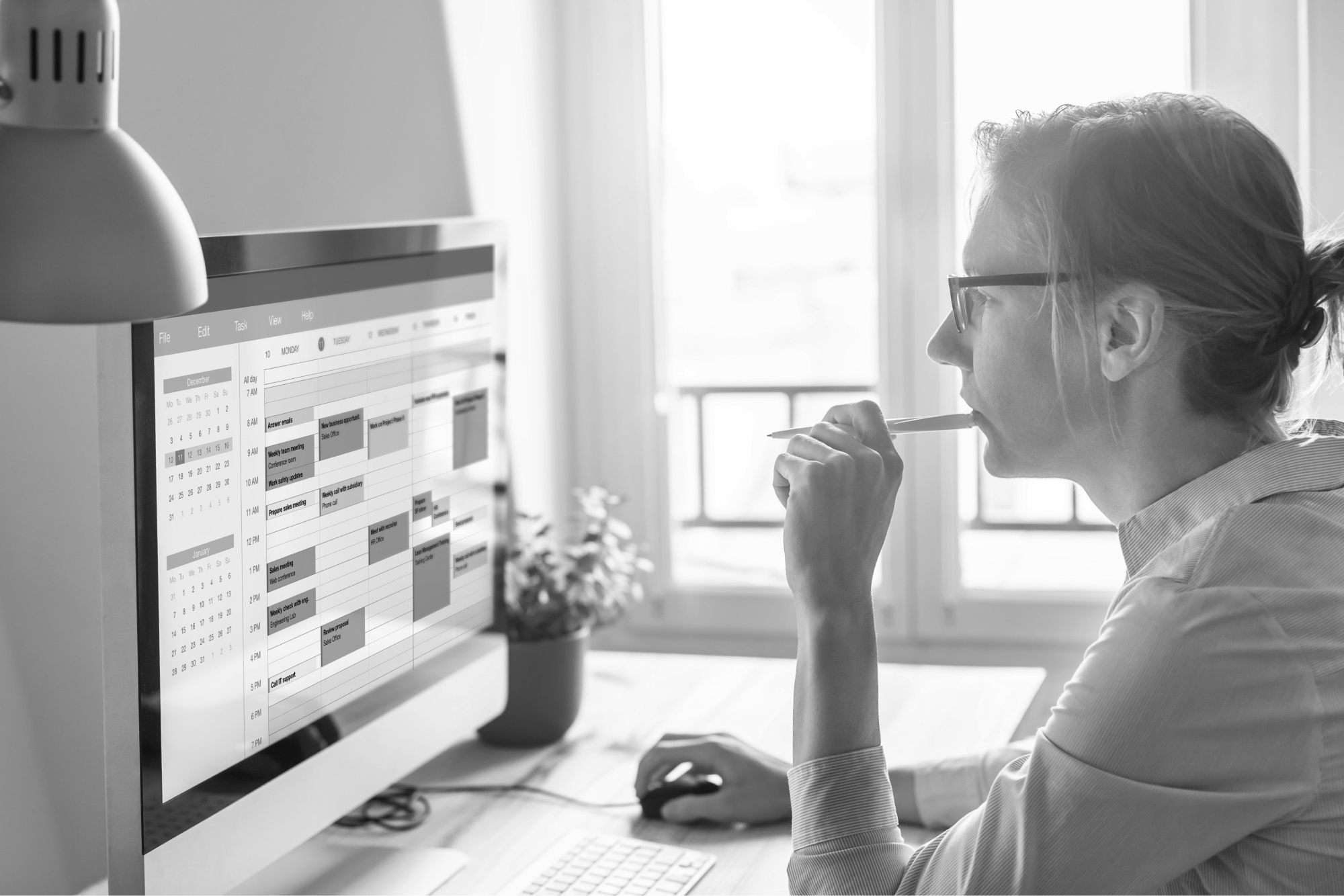 Woman Planning Events on a Computer BW